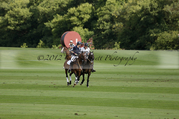 Pandas (white) v Home Farm (navy) in a Park House West Sussex Cup Polo match on Brooksfield at Cowdray Park Polo Club on Friday 30 August 2013. 2013.08.30 www.polopictures.co.uk