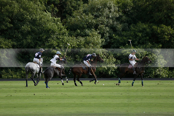 Pandas (white) v Home Farm (navy) in a Park House West Sussex Cup Polo match on Brooksfield at Cowdray Park Polo Club on Friday 30 August 2013. 2013.08.30 www.polopictures.co.uk