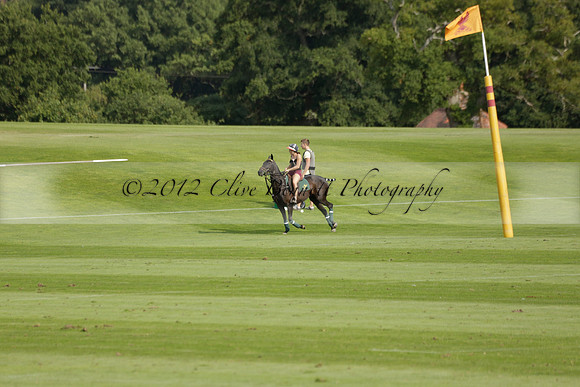 Pandas (white) v Home Farm (navy) in a Park House West Sussex Cup Polo match on Brooksfield at Cowdray Park Polo Club on Friday 30 August 2013. 2013.08.30 www.polopictures.co.uk