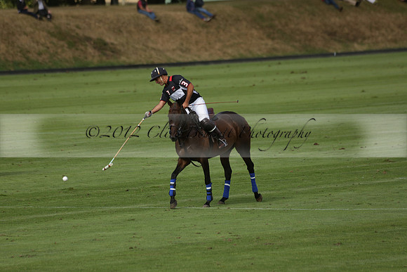 Jaeger Le Coultre (black)  v Wairakei Pastoral (white) in a Jaeger Le Coultre Holden White Cup polo match played on 29 July 2013 at Cowdray Park Polo Club on Brooksfieldwww.polopictures.co.uk