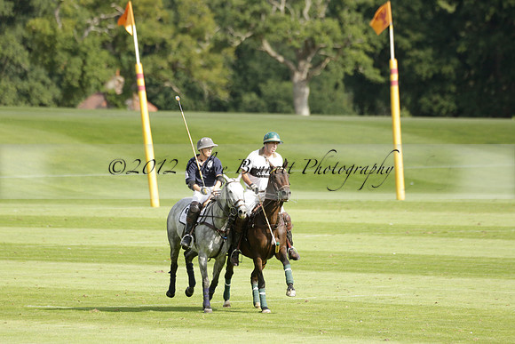 Pandas (white) v Home Farm (navy) in a Park House West Sussex Cup Polo match on Brooksfield at Cowdray Park Polo Club on Friday 30 August 2013. 2013.08.30 www.polopictures.co.uk