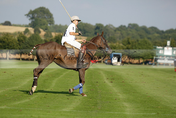 Pluma Negra (white) v Shoreline (black) in the Brecknock Cup Subsidiary final polo match played on Sunday 25 August 2013 at Cowdray Park Polo Club on Ambersham 1. 2013.10.12 www.polopictures.co.uk
