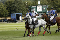 Combe Place (blue) v Silver Fox (white) in a Park House West Sussex Cup Polo match on Ambersham 1 at Cowdray Park Polo Club on Friday 30 August 2013. 2013.08.30 www.polopictures.co.uk
