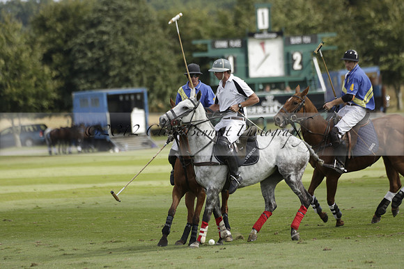 Combe Place (blue) v Silver Fox (white) in a Park House West Sussex Cup Polo match on Ambersham 1 at Cowdray Park Polo Club on Friday 30 August 2013. 2013.08.30 www.polopictures.co.uk
