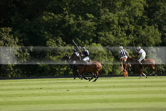 Pandas (white) v Home Farm (navy) in a Park House West Sussex Cup Polo match on Brooksfield at Cowdray Park Polo Club on Friday 30 August 2013. 2013.08.30 www.polopictures.co.uk