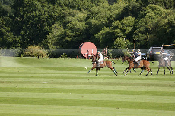 Pandas (white) v Home Farm (navy) in a Park House West Sussex Cup Polo match on Brooksfield at Cowdray Park Polo Club on Friday 30 August 2013. 2013.08.30 www.polopictures.co.uk
