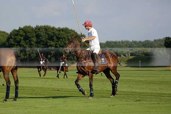 Pluma Negra (white) v Shoreline (black) in the Brecknock Cup Subsidiary final polo match played on Sunday 25 August 2013 at Cowdray Park Polo Club on Ambersham 1. 2013.10.12 www.polopictures.co.uk