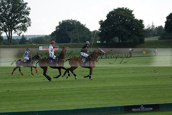 Pluma Negra (white) v Shoreline (black) in the Brecknock Cup Subsidiary final polo match played on Sunday 25 August 2013 at Cowdray Park Polo Club on Ambersham 1. 2013.10.12 www.polopictures.co.uk