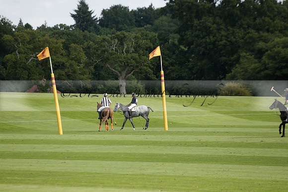 Pandas (white) v Home Farm (navy) in a Park House West Sussex Cup Polo match on Brooksfield at Cowdray Park Polo Club on Friday 30 August 2013. 2013.08.30 www.polopictures.co.uk