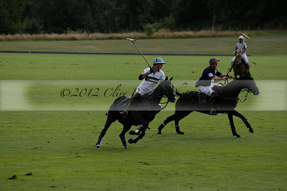 Pandas (white) v Home Farm (navy) in a Park House West Sussex Cup Polo match on Brooksfield at Cowdray Park Polo Club on Friday 30 August 2013. 2013.08.30 www.polopictures.co.uk