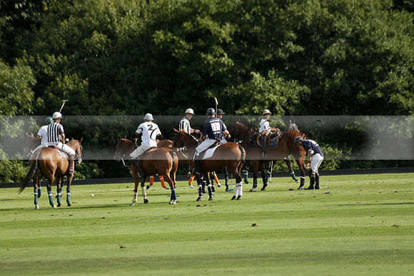 Pandas (white) v Home Farm (navy) in a Park House West Sussex Cup Polo match on Brooksfield at Cowdray Park Polo Club on Friday 30 August 2013. 2013.08.30 www.polopictures.co.uk