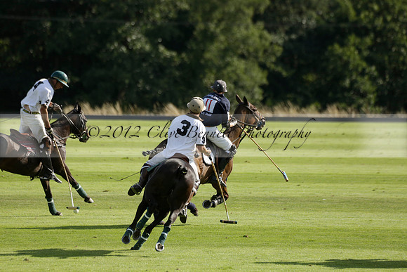 Pandas (white) v Home Farm (navy) in a Park House West Sussex Cup Polo match on Brooksfield at Cowdray Park Polo Club on Friday 30 August 2013. 2013.08.30 www.polopictures.co.uk