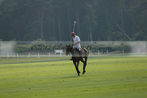 Pluma Negra (white) v Shoreline (black) in the Brecknock Cup Subsidiary final polo match played on Sunday 25 August 2013 at Cowdray Park Polo Club on Ambersham 1. 2013.10.12 www.polopictures.co.uk