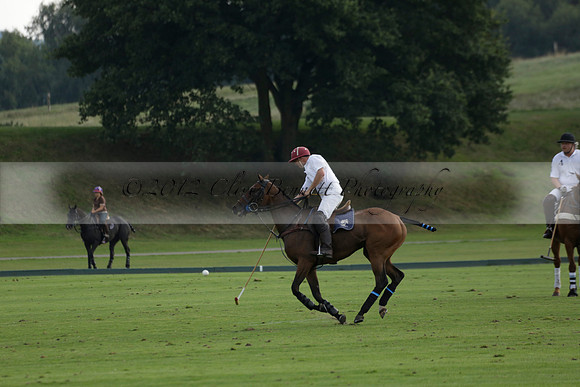 Pluma Negra (white) v Shoreline (black) in the Brecknock Cup Subsidiary final polo match played on Sunday 25 August 2013 at Cowdray Park Polo Club on Ambersham 1. 2013.10.12 www.polopictures.co.uk