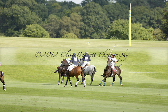Pandas (white) v Home Farm (navy) in a Park House West Sussex Cup Polo match on Brooksfield at Cowdray Park Polo Club on Friday 30 August 2013. 2013.08.30 www.polopictures.co.uk