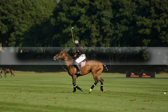 Pluma Negra (white) v Shoreline (black) in the Brecknock Cup Subsidiary final polo match played on Sunday 25 August 2013 at Cowdray Park Polo Club on Ambersham 1. 2013.10.12 www.polopictures.co.uk