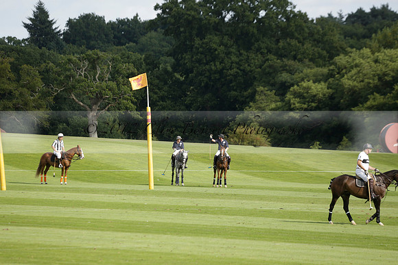 Pandas (white) v Home Farm (navy) in a Park House West Sussex Cup Polo match on Brooksfield at Cowdray Park Polo Club on Friday 30 August 2013. 2013.08.30 www.polopictures.co.uk