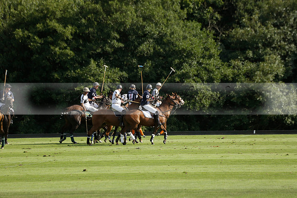 Pandas (white) v Home Farm (navy) in a Park House West Sussex Cup Polo match on Brooksfield at Cowdray Park Polo Club on Friday 30 August 2013. 2013.08.30 www.polopictures.co.uk