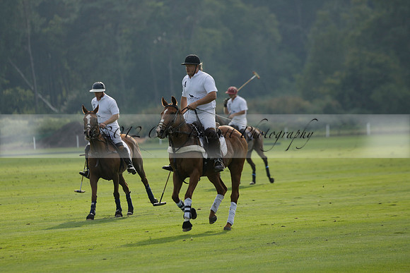 Pluma Negra (white) v Shoreline (black) in the Brecknock Cup Subsidiary final polo match played on Sunday 25 August 2013 at Cowdray Park Polo Club on Ambersham 1. 2013.10.12 www.polopictures.co.uk