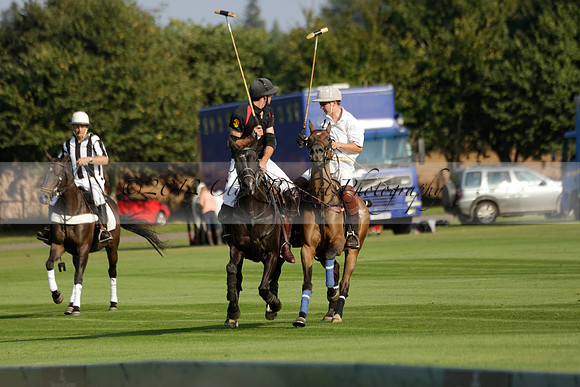 Pluma Negra (white) v Shoreline (black) in the Brecknock Cup Subsidiary final polo match played on Sunday 25 August 2013 at Cowdray Park Polo Club on Ambersham 1. 2013.10.12 www.polopictures.co.uk