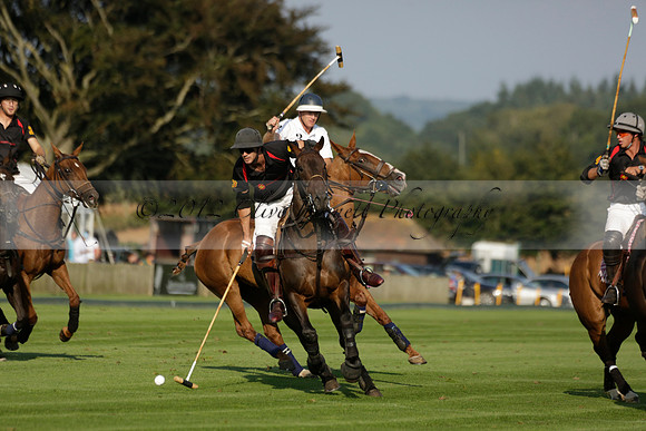Pluma Negra (white) v Shoreline (black) in the Brecknock Cup Subsidiary final polo match played on Sunday 25 August 2013 at Cowdray Park Polo Club on Ambersham 1. 2013.10.12 www.polopictures.co.uk