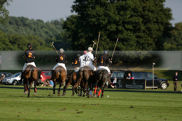 Pluma Negra (white) v Shoreline (black) in the Brecknock Cup Subsidiary final polo match played on Sunday 25 August 2013 at Cowdray Park Polo Club on Ambersham 1. 2013.10.12 www.polopictures.co.uk
