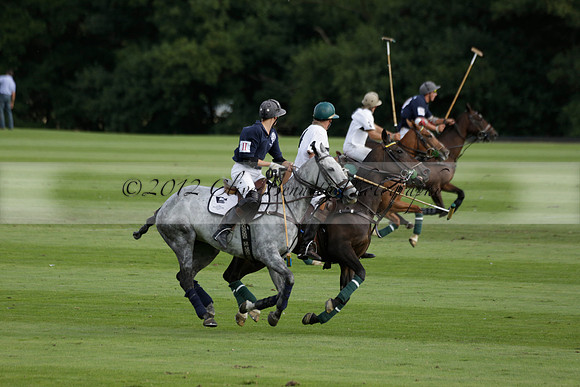 Pandas (white) v Home Farm (navy) in a Park House West Sussex Cup Polo match on Brooksfield at Cowdray Park Polo Club on Friday 30 August 2013. 2013.08.30 www.polopictures.co.uk
