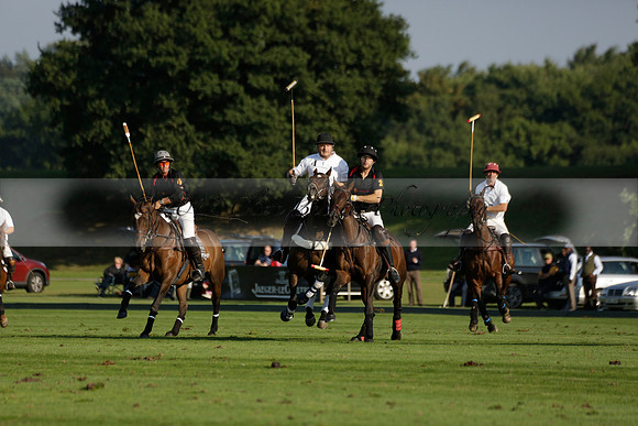 Pluma Negra (white) v Shoreline (black) in the Brecknock Cup Subsidiary final polo match played on Sunday 25 August 2013 at Cowdray Park Polo Club on Ambersham 1. 2013.10.12 www.polopictures.co.uk