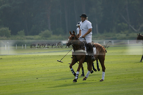 Pluma Negra (white) v Shoreline (black) in the Brecknock Cup Subsidiary final polo match played on Sunday 25 August 2013 at Cowdray Park Polo Club on Ambersham 1. 2013.10.12 www.polopictures.co.uk