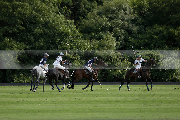 Pandas (white) v Home Farm (navy) in a Park House West Sussex Cup Polo match on Brooksfield at Cowdray Park Polo Club on Friday 30 August 2013. 2013.08.30 www.polopictures.co.uk