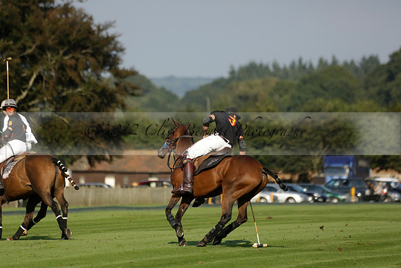 Pluma Negra (white) v Shoreline (black) in the Brecknock Cup Subsidiary final polo match played on Sunday 25 August 2013 at Cowdray Park Polo Club on Ambersham 1. 2013.10.12 www.polopictures.co.uk