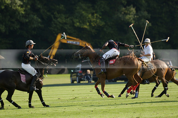 Pluma Negra (white) v Shoreline (black) in the Brecknock Cup Subsidiary final polo match played on Sunday 25 August 2013 at Cowdray Park Polo Club on Ambersham 1. 2013.10.12 www.polopictures.co.uk