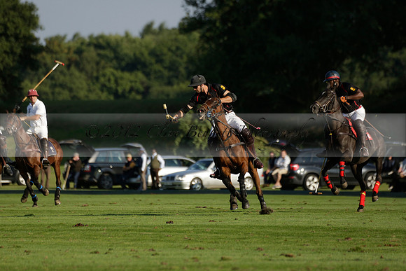 Pluma Negra (white) v Shoreline (black) in the Brecknock Cup Subsidiary final polo match played on Sunday 25 August 2013 at Cowdray Park Polo Club on Ambersham 1. 2013.10.12 www.polopictures.co.uk