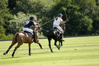 Pandas (white) v Home Farm (navy) in a Park House West Sussex Cup Polo match on Brooksfield at Cowdray Park Polo Club on Friday 30 August 2013. 2013.08.30 www.polopictures.co.uk