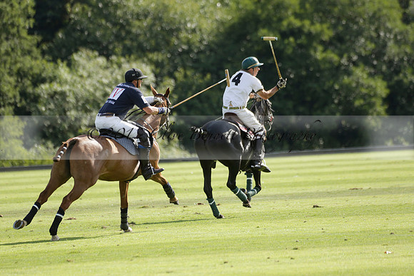 Pandas (white) v Home Farm (navy) in a Park House West Sussex Cup Polo match on Brooksfield at Cowdray Park Polo Club on Friday 30 August 2013. 2013.08.30 www.polopictures.co.uk