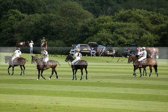 Pandas (white) v Home Farm (navy) in a Park House West Sussex Cup Polo match on Brooksfield at Cowdray Park Polo Club on Friday 30 August 2013. 2013.08.30 www.polopictures.co.uk
