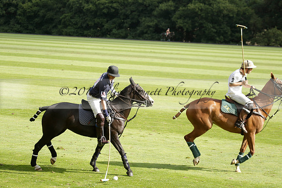 Pandas (white) v Home Farm (navy) in a Park House West Sussex Cup Polo match on Brooksfield at Cowdray Park Polo Club on Friday 30 August 2013. 2013.08.30 www.polopictures.co.uk