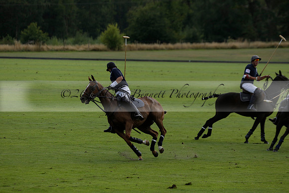 Pandas (white) v Home Farm (navy) in a Park House West Sussex Cup Polo match on Brooksfield at Cowdray Park Polo Club on Friday 30 August 2013. 2013.08.30 www.polopictures.co.uk