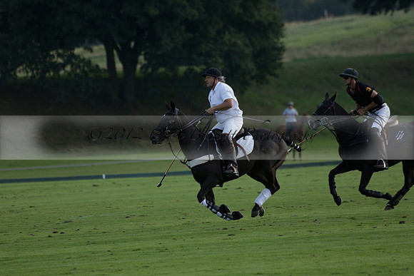 Pluma Negra (white) v Shoreline (black) in the Brecknock Cup Subsidiary final polo match played on Sunday 25 August 2013 at Cowdray Park Polo Club on Ambersham 1. 2013.10.12 www.polopictures.co.uk