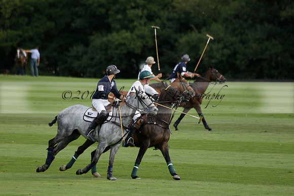 Pandas (white) v Home Farm (navy) in a Park House West Sussex Cup Polo match on Brooksfield at Cowdray Park Polo Club on Friday 30 August 2013. 2013.08.30 www.polopictures.co.uk