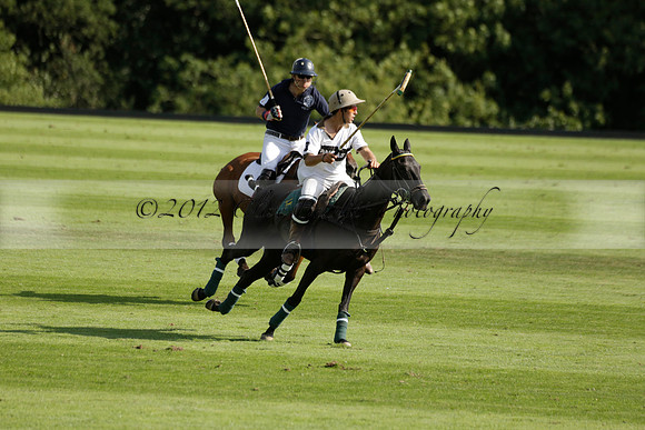 Pandas (white) v Home Farm (navy) in a Park House West Sussex Cup Polo match on Brooksfield at Cowdray Park Polo Club on Friday 30 August 2013. 2013.08.30 www.polopictures.co.uk