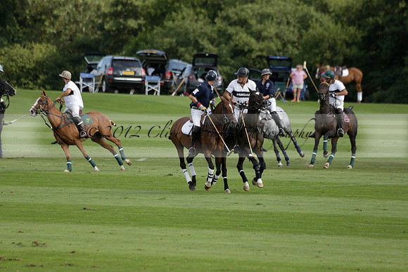 Pandas (white) v Home Farm (navy) in a Park House West Sussex Cup Polo match on Brooksfield at Cowdray Park Polo Club on Friday 30 August 2013. 2013.08.30 www.polopictures.co.uk