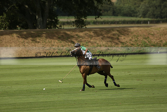 Jaeger Le Coultre (black)  v Wairakei Pastoral (white) in a Jaeger Le Coultre Holden White Cup polo match played on 29 July 2013 at Cowdray Park Polo Club on Brooksfieldwww.polopictures.co.uk
