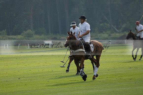Pluma Negra (white) v Shoreline (black) in the Brecknock Cup Subsidiary final polo match played on Sunday 25 August 2013 at Cowdray Park Polo Club on Ambersham 1. 2013.10.12 www.polopictures.co.uk