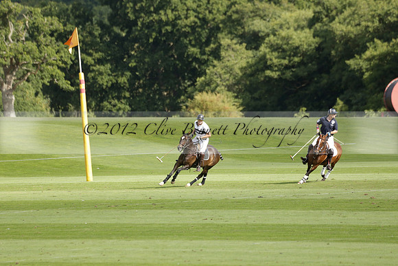 Pandas (white) v Home Farm (navy) in a Park House West Sussex Cup Polo match on Brooksfield at Cowdray Park Polo Club on Friday 30 August 2013. 2013.08.30 www.polopictures.co.uk