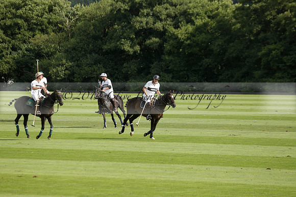 Pandas (white) v Home Farm (navy) in a Park House West Sussex Cup Polo match on Brooksfield at Cowdray Park Polo Club on Friday 30 August 2013. 2013.08.30 www.polopictures.co.uk