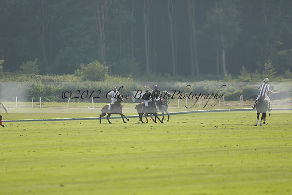 Pluma Negra (white) v Shoreline (black) in the Brecknock Cup Subsidiary final polo match played on Sunday 25 August 2013 at Cowdray Park Polo Club on Ambersham 1. 2013.10.12 www.polopictures.co.uk