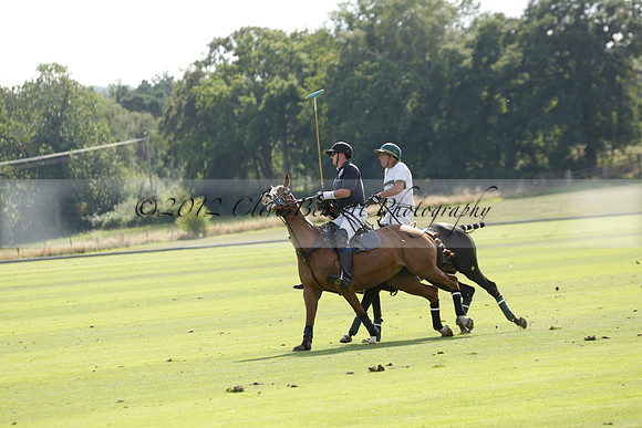 Pandas (white) v Home Farm (navy) in a Park House West Sussex Cup Polo match on Brooksfield at Cowdray Park Polo Club on Friday 30 August 2013. 2013.08.30 www.polopictures.co.uk