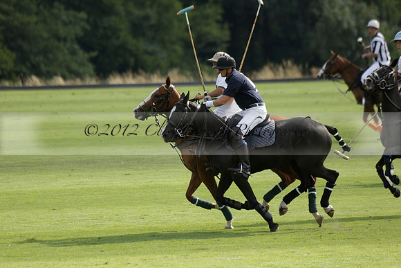 Pandas (white) v Home Farm (navy) in a Park House West Sussex Cup Polo match on Brooksfield at Cowdray Park Polo Club on Friday 30 August 2013. 2013.08.30 www.polopictures.co.uk
