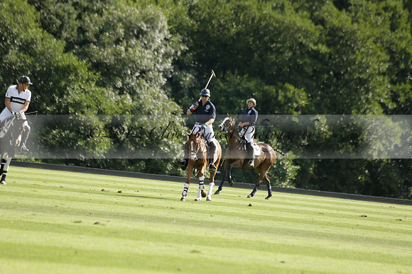 Pandas (white) v Home Farm (navy) in a Park House West Sussex Cup Polo match on Brooksfield at Cowdray Park Polo Club on Friday 30 August 2013. 2013.08.30 www.polopictures.co.uk